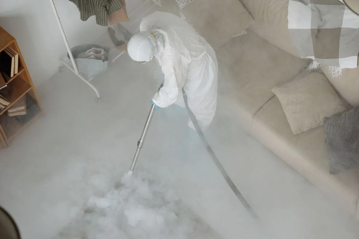 Biohazard cleanup technician in protective equipment, Salem, WV